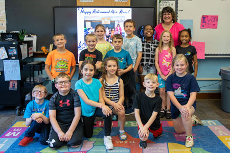  Mrs. Raes with a class of students